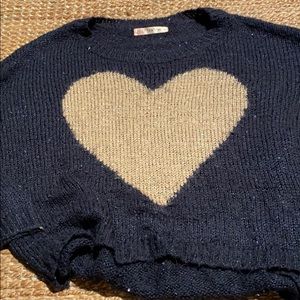 Blue sweater with large gold heart